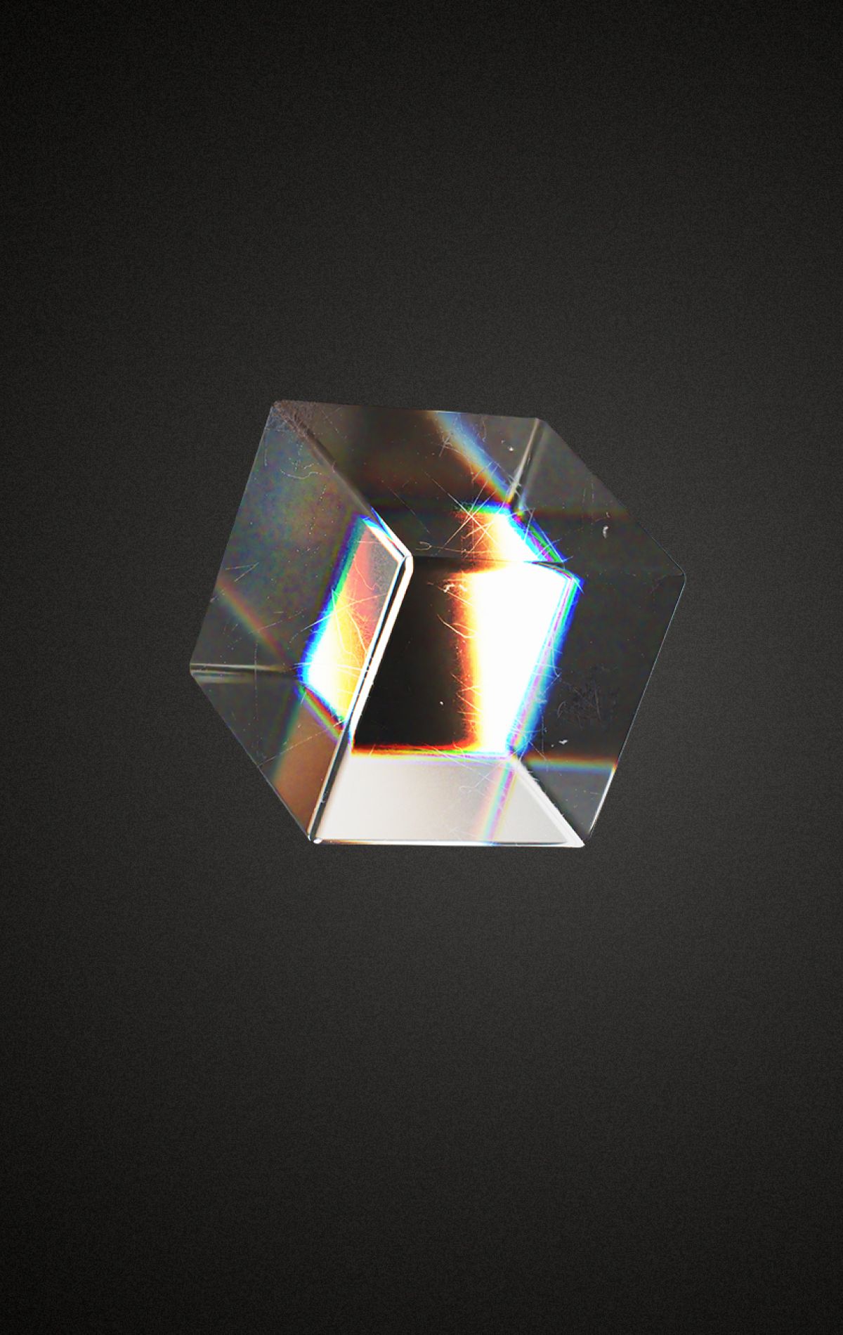 Cubo di vetro che rifrange la luce su sfondo scuro